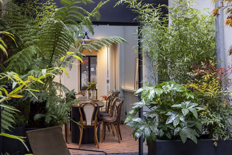 Preview of La Closerie, tree-lined courtyard garden of DADOU hotel Paris 17