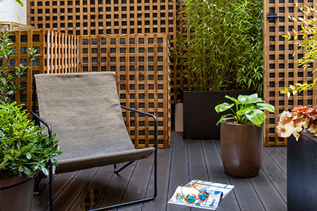 Detail of La Closerie, tree-lined courtyard garden of DADOU hotel Paris 17
